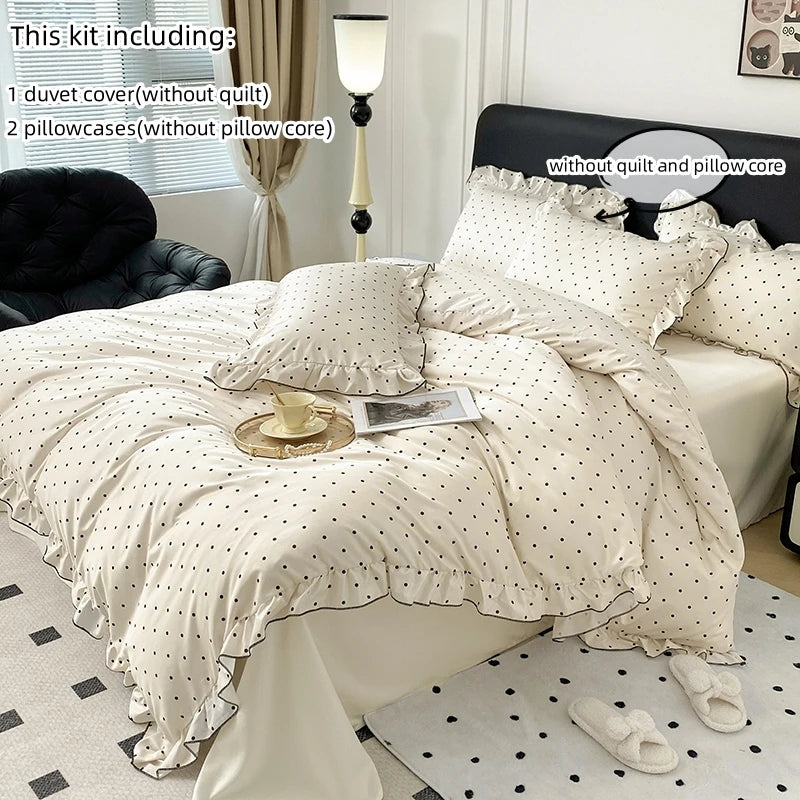 A set of Korean lace duvet cover, pillowcases, and a lamp displayed on a bed.