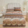 A bed skirt set featuring a multi-toned brown and beige animal print pattern with floral ruffle trim.