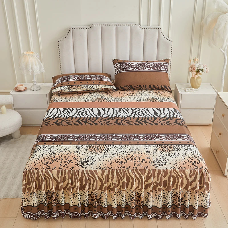 A bed skirt set featuring a multi-toned brown and beige animal print pattern with floral ruffle trim.