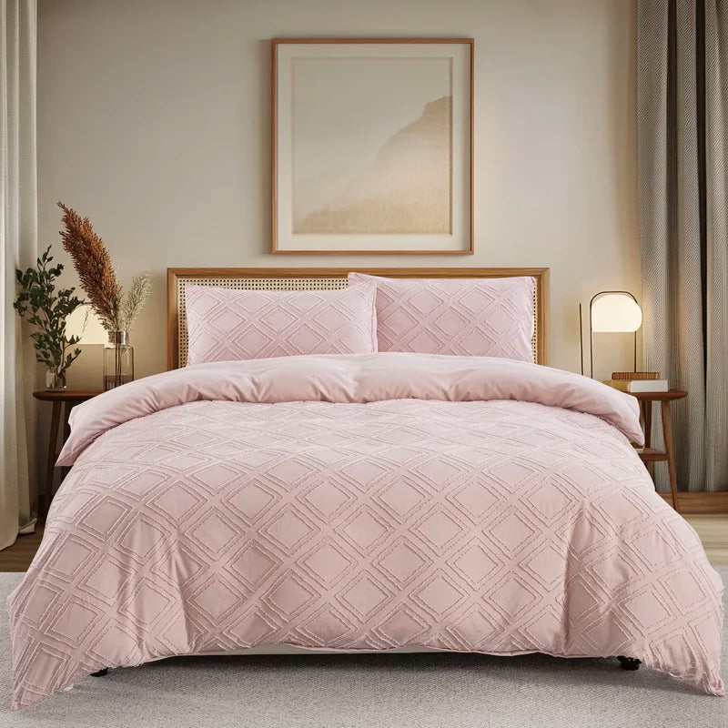 A pink boho tufted microfiber duvet cover set displayed on a bed with neutral decor.