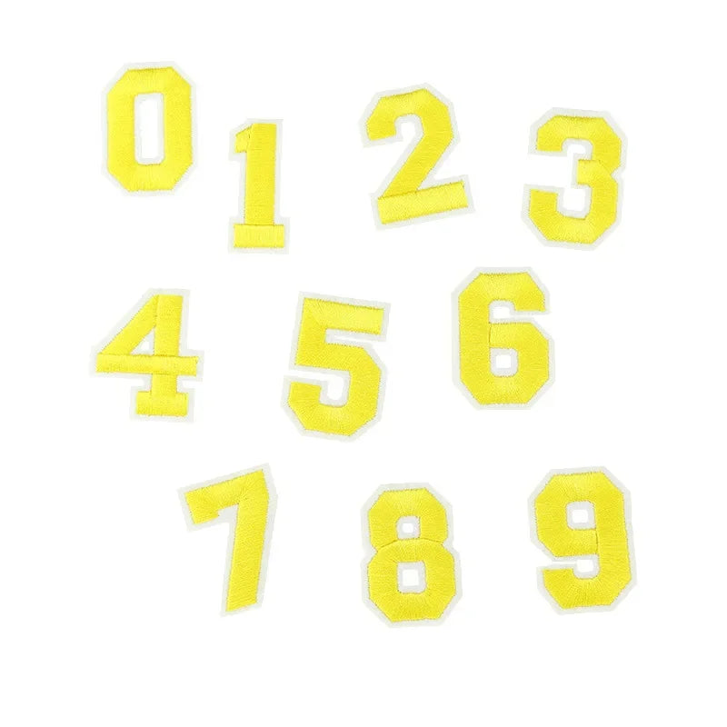 A set of yellow customizable number patches, numbered 0 through 9.