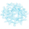 A scattered pile of light blue satin ribbon bows for craft and decoration.