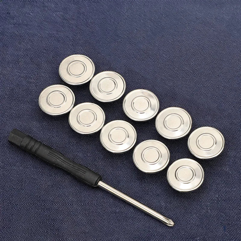 A row of silver metal snap buttons is displayed on a dark blue fabric background.