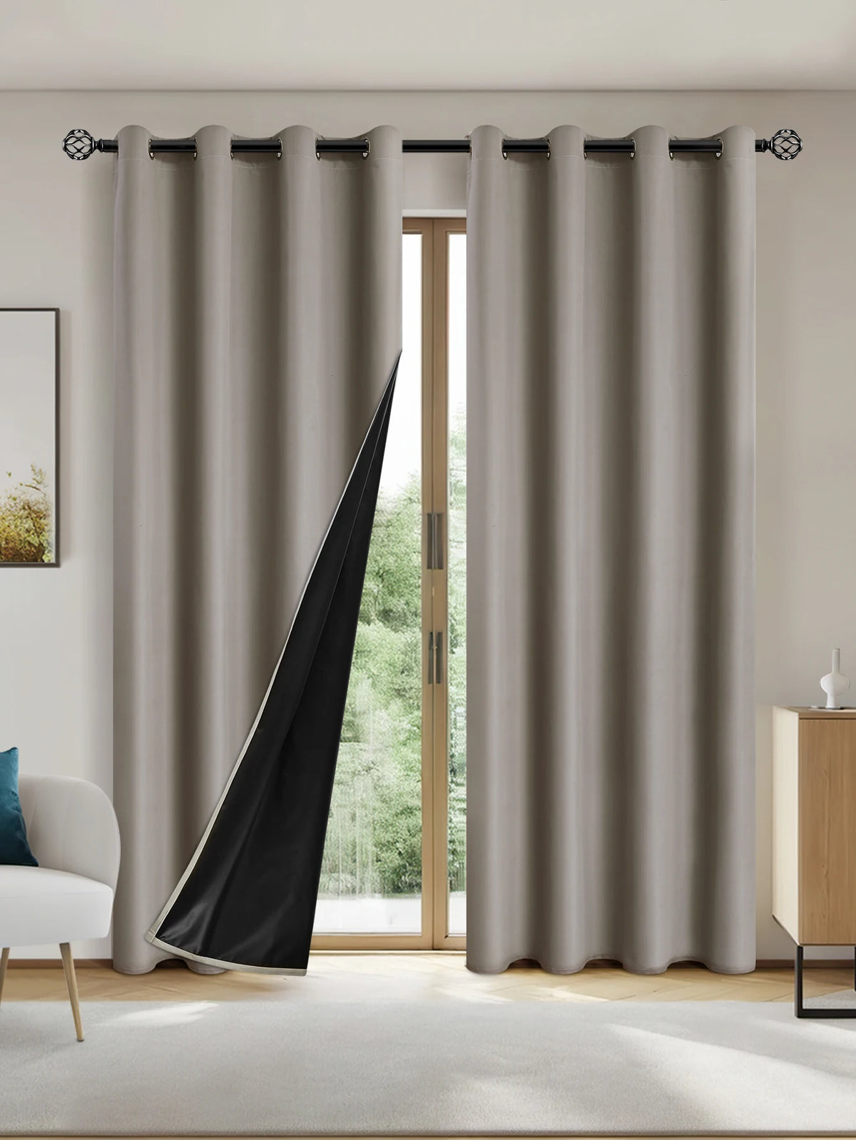 Floor-length taupe blackout curtains hanging in a doorway frame.