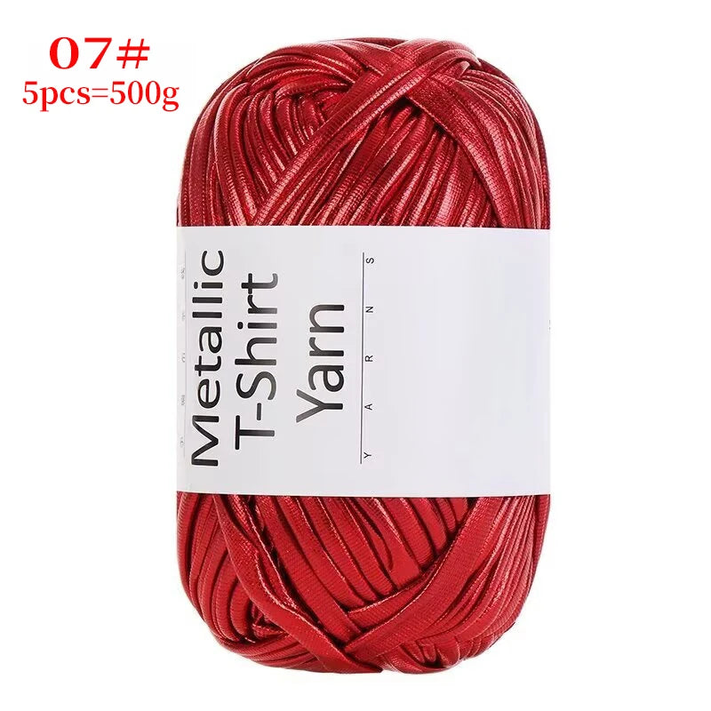 Red metallic T-shirt yarn skein with a visible label and coiled texture
