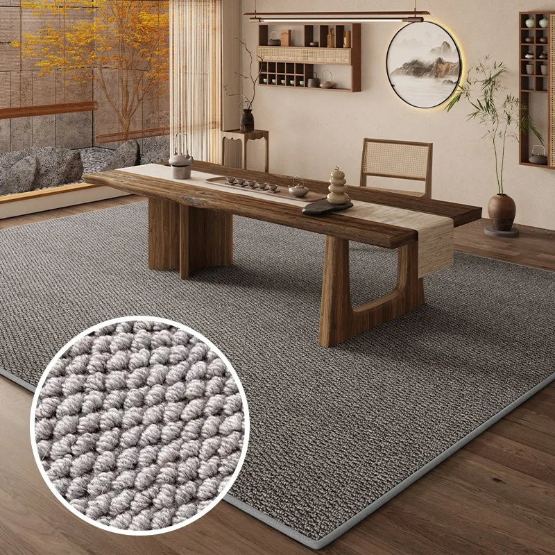 A rectangular faux sisal runner rug placed on a wooden table in a modern interior setting.