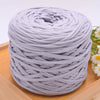 A ball of light purple craft yarn for knitting and DIY displayed on a wooden surface.