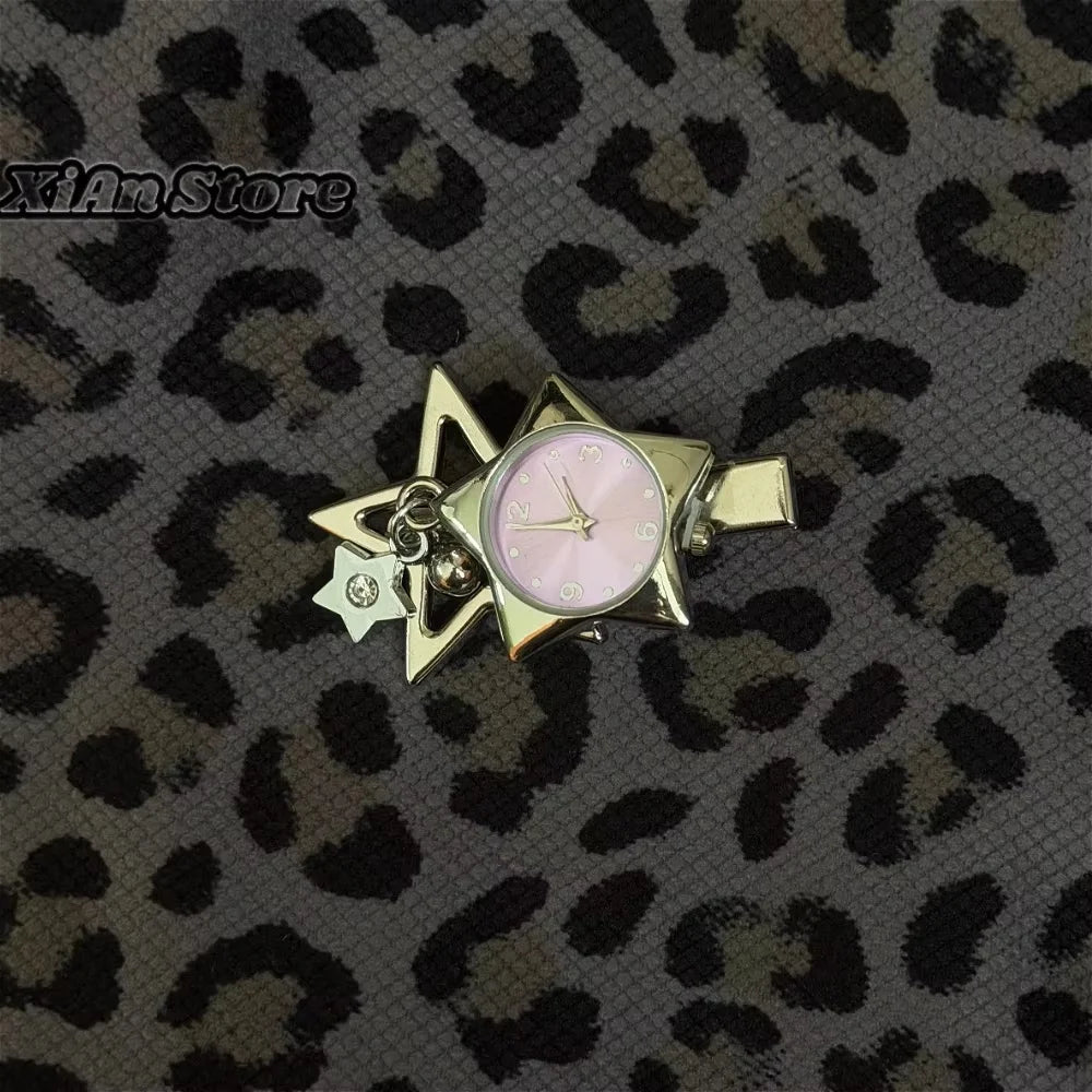 A gold-toned star-shaped pocket watch keychain with a pink face and adjustable clock mechanism.