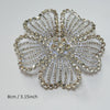 Silver rhinestone flower applique patch with a detailed, radiating design.