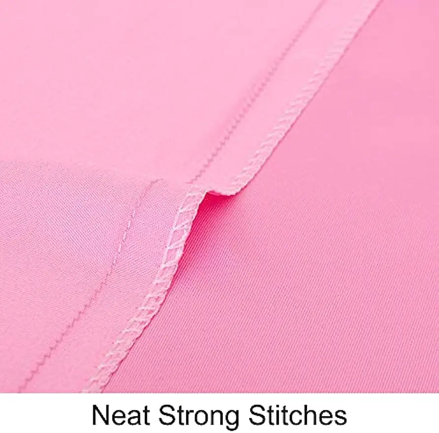 Close-up of a pink silky satin toddler pillowcase showing neat strong stitching.