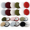 A set of round fabric-covered shank buttons in various colors including gray, maroon, beige, and olive green.