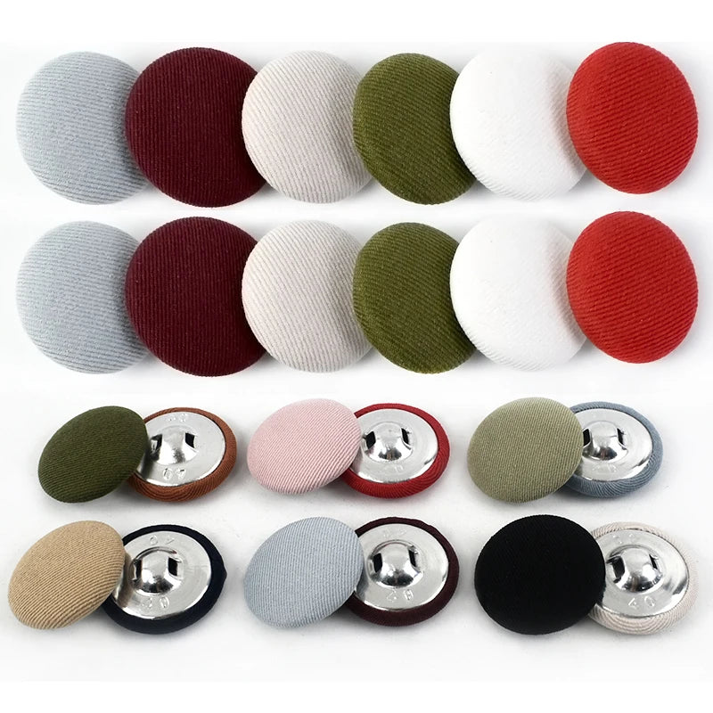 A set of round fabric-covered shank buttons in various colors including gray, maroon, beige, and olive green.