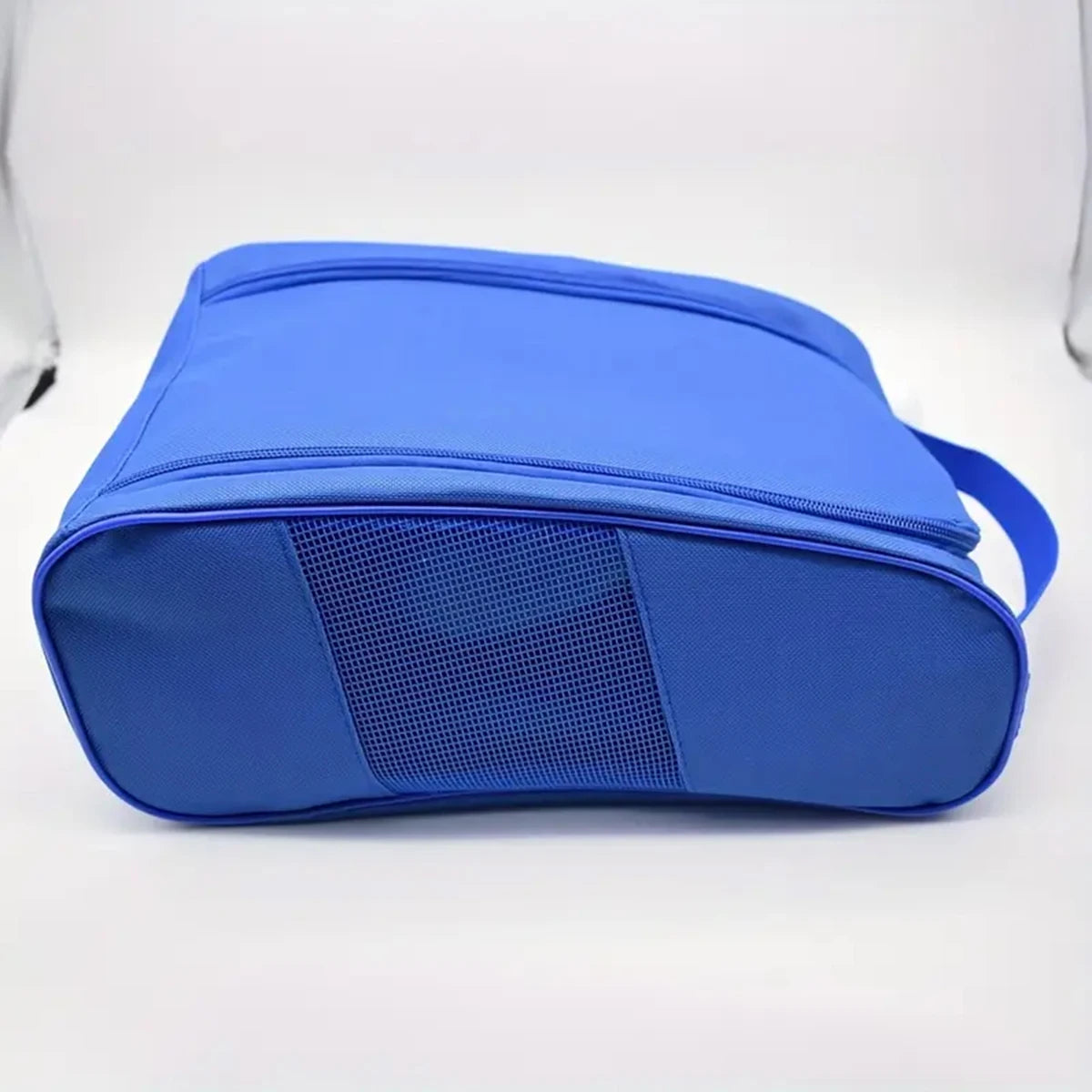 A royal blue portable shoe carrier bag with a mesh panel on the front.