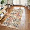 A vintage trellis rug runner set featuring an intricate floral and geometric pattern in shades of blue, orange, and cream on 