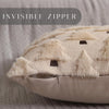 A close-up of a beige Christmas tree plush throw pillow cover with a textured, light cream fabric and dark brown geometric pa