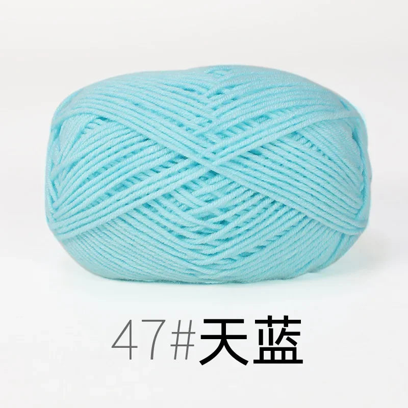 A ball of light blue organic cotton 4ply knitting yarn for crafts.