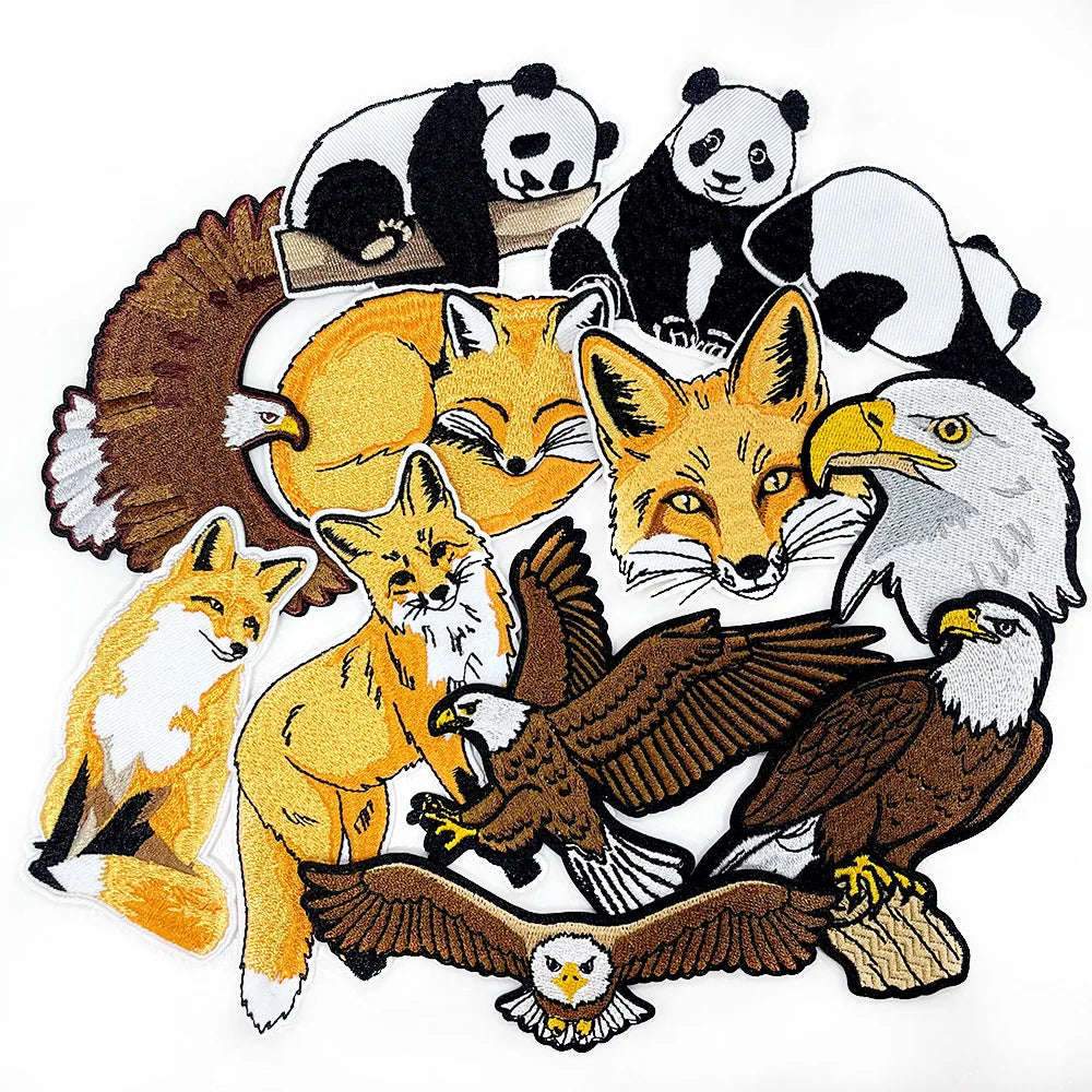 An embroidery patch featuring various animal designs including pandas, foxes, and an eagle.
