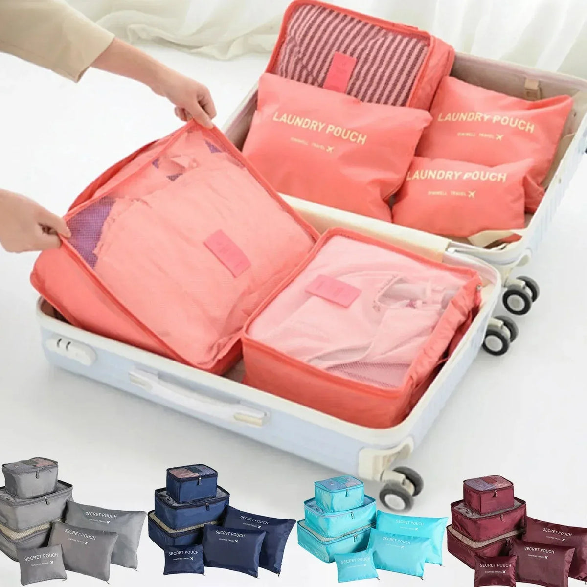 A set of six colored fabric laundry pouches and packing cubes are displayed in a white suitcase.