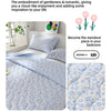A light blue quilted bedding set featuring a floral pattern, designed for sweet scheming.