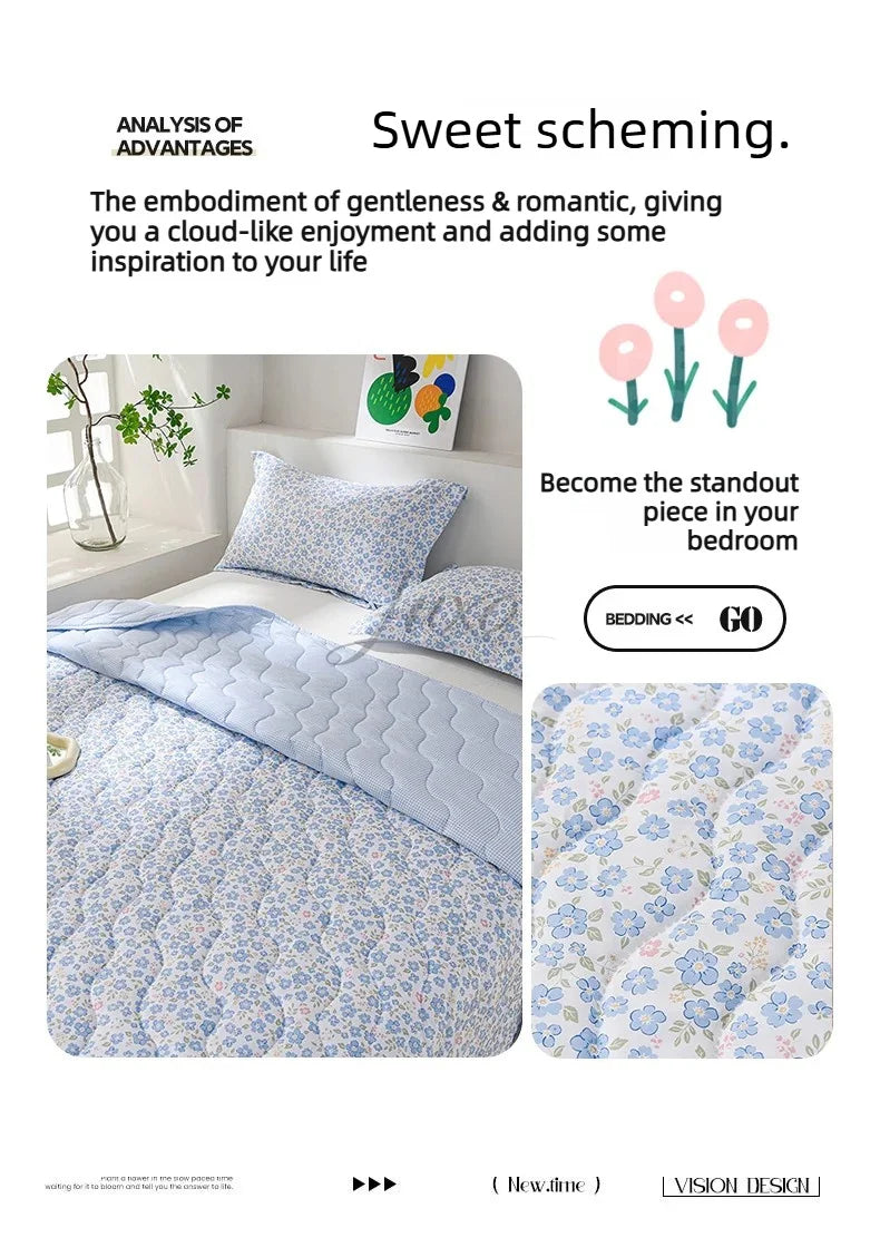 A light blue quilted bedding set featuring a floral pattern, designed for sweet scheming.