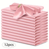 A stack of twelve pink silky satin dinner napkins with a decorative bow on top.