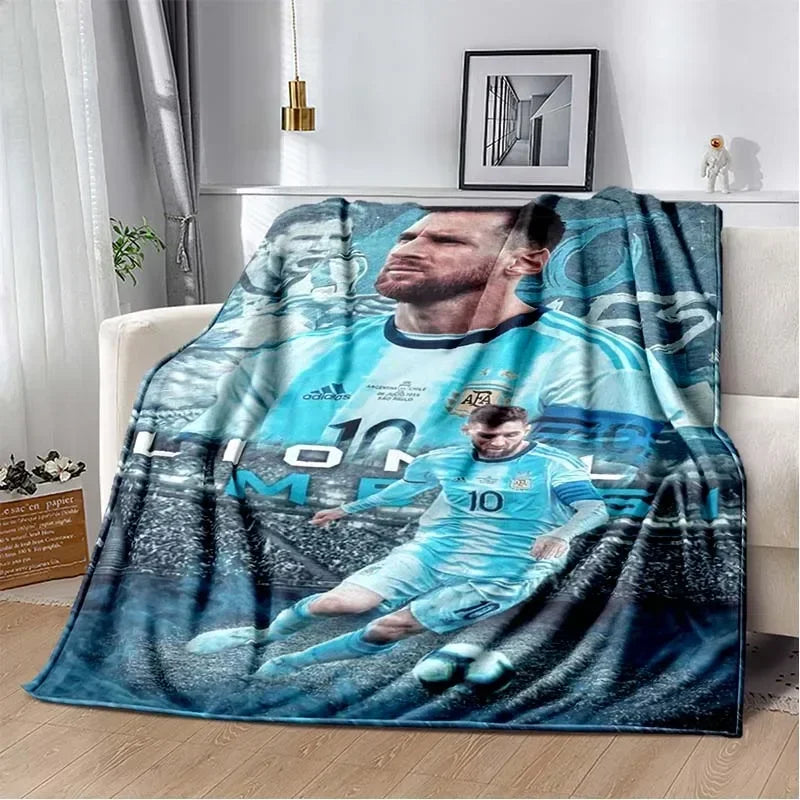 A blue and white football player graphic blanket draped over a sofa.
