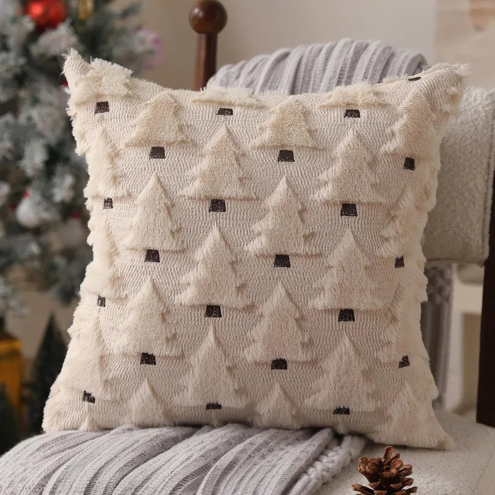 A cream-colored throw pillow with a textured pattern resembling stylized Christmas trees.