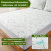 White bamboo fiber fitted sheet with a leaf pattern displayed on a mattress.