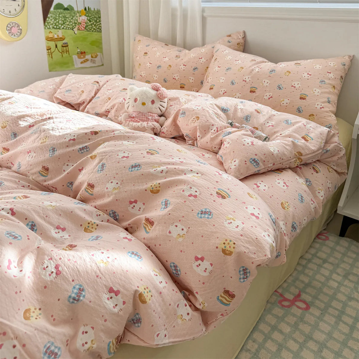 A pink floral microfiber duvet set with a matching cover and stuffed animal on a bed.