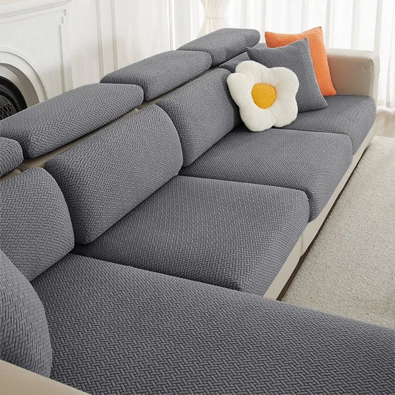 Gray jacquard elastic sofa cushion slipcover with an orange accent pillow