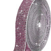 Close-up of a crystal rhinestone sticker ribbon with diamond trim in pink and silver tones.
