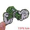 Green embroidered letter iron-on patch featuring the text ZOO and a dollar sign