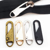 A set of five metal zipper pulls in gold and silver tones are displayed on a white background.