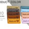 Ten handmade leather tags in various colors stacked horizontally, showing the text Made with hearts.
