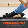A woman exercising on a treadmill with interlocking rubber mats for fitness.