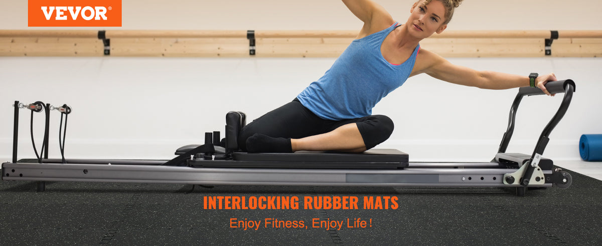 A woman exercising on a treadmill with interlocking rubber mats for fitness.